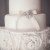 three tier wedding cake with ruffle rose