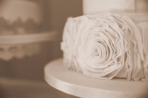 three tier wedding cake with ruffle rose