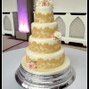 4 tier wedding cake with golden lace and roses