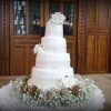 4-tier-wedding-cake-with-roses-and-cake-lace